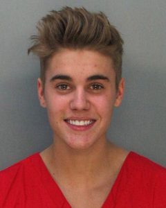 MIAMI, FL - JANUARY 23: In this handout photo provided by Miami-Dade Police Department, pop star Justin Bieber poses for a booking photo at the Miami-Dade Police Department on January 23, 2014 in Miami, Florida. Justin Bieber was charged with drunken driving, resisting arrest and driving without a valid license after Miami Beach Police found the pop star street racing on Thursday morning. (Photo by Miami-Dade Police Department via Getty Images)